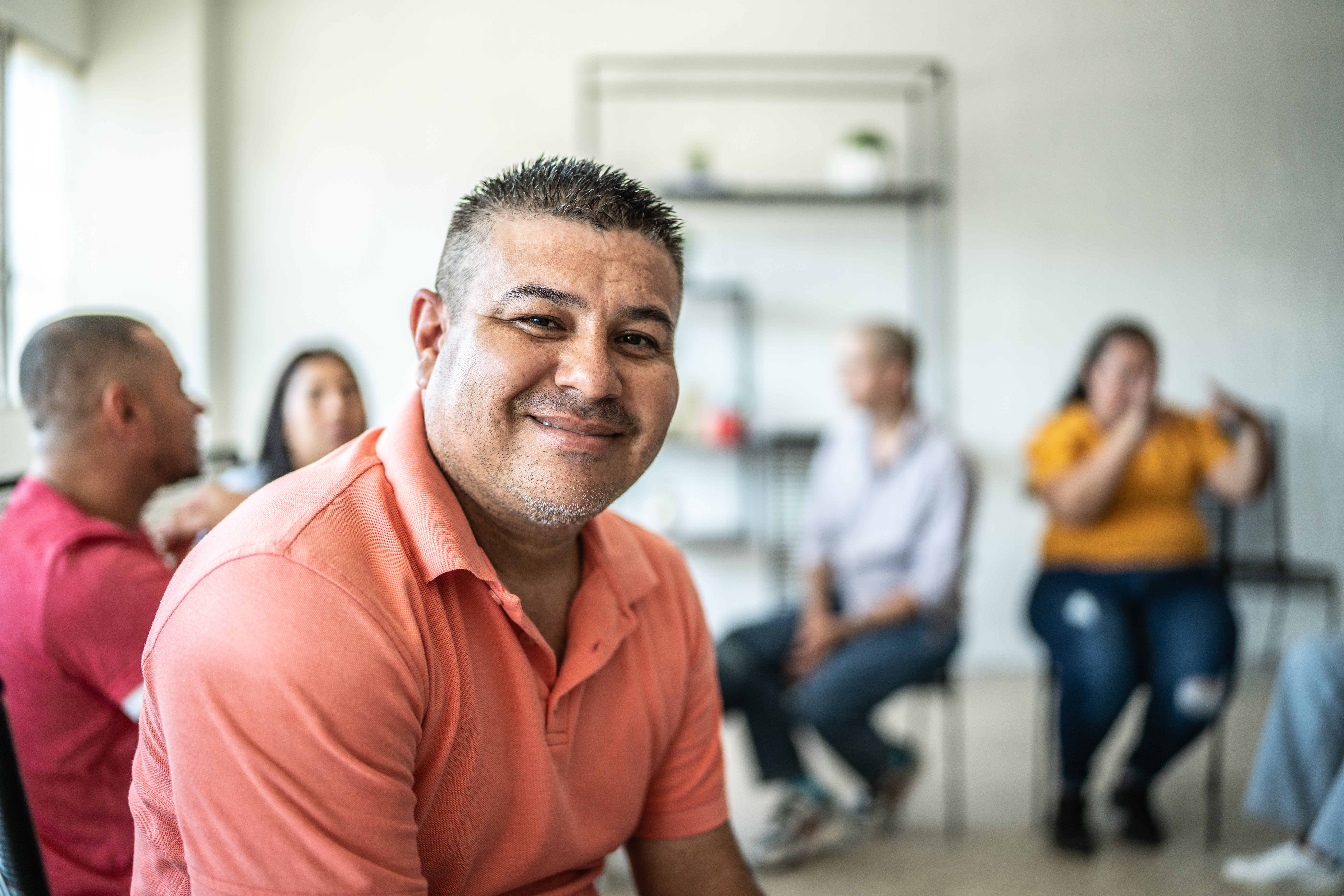 Individual in group therapy meeting