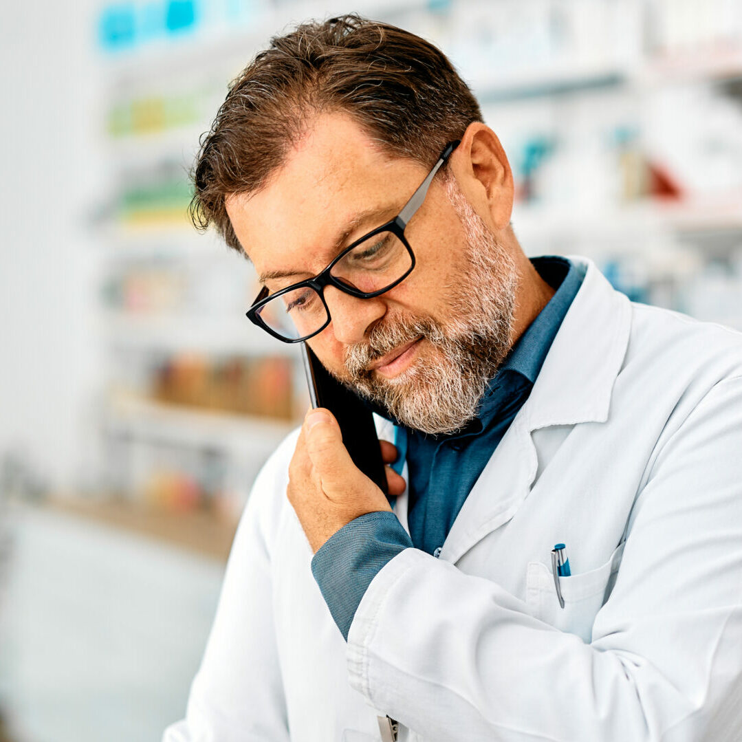 hybrid pharmacy model pharmacist on phone with doctor