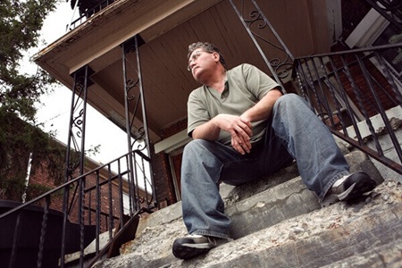 Man sitting on front porch